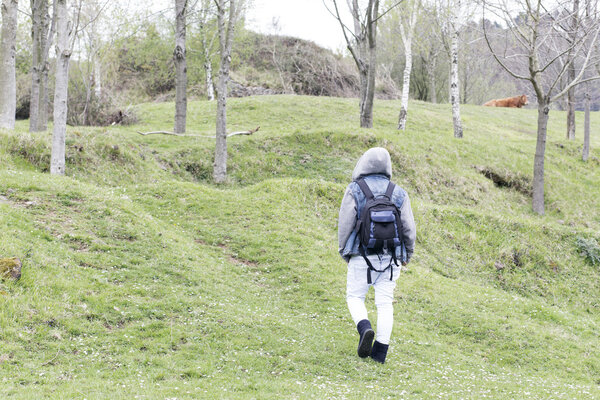 One person walking into the mountain.