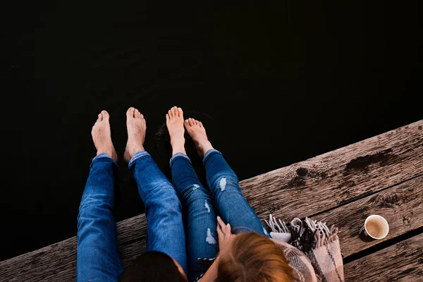 Young Couple on Warm Old Pier — Stock Photo, Image