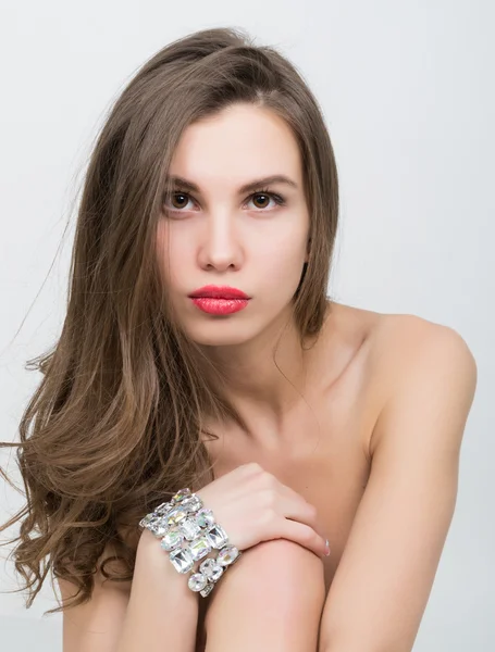 Close-up portrait of a beautiful girl with red lips, brilliant bracelet on the wrist. Red Sexy Lips and Nails closeup — ストック写真
