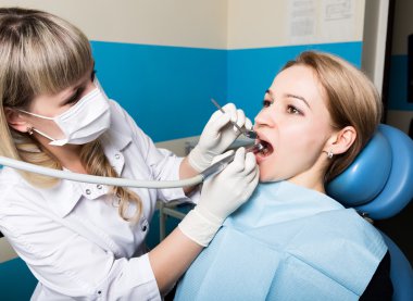 The reception was at the female dentist. Doctor examines the oral cavity on tooth decay. Caries protection. doctor puts the patient an anesthetic injection. clipart