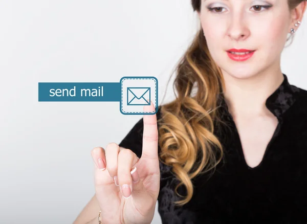 Technology, internet and networking concept. beautiful woman in a black business shirt. woman presses send mail button on virtual screens — Stockfoto