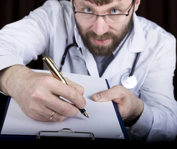 close-up hands of a medical doctor, the doctor signs a handle documents. Doctor writes medical history. write a prescription patient data history