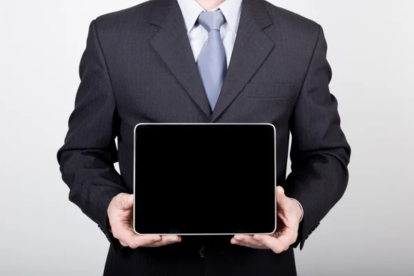 Technology, internet and networking in business concept - businessman holding a tablet pc with blank dark screen. Internet technologies in business — Stock Photo, Image