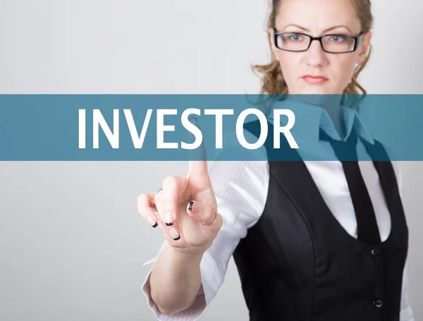Investor written on a virtual screen. Internet technologies in business and tourism. woman in business suit and tie, presses a finger on a virtual screen — Stock Photo, Image