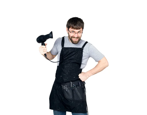 Handsome Male barber holding a hairdryer and posing for the camera. isolated on white background — Stock Photo, Image