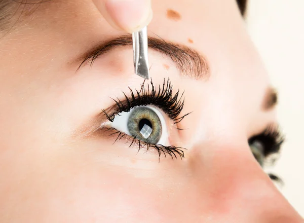 Beautiful young woman eyelash extension. Woman eye with long eyelashes. Beauty salon concept — Stock Photo, Image