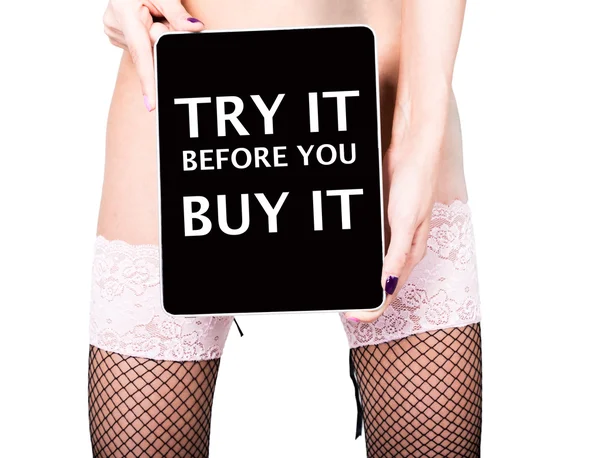 Technology, internet and networking - close-up ass of girl in lacy lingerie, holding a tablet pc try it before you buy it sign. Adult content, young woman holding aq gift — Φωτογραφία Αρχείου