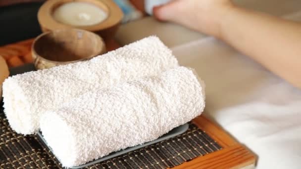 Young woman gets a foot massage in the spa salon. close-up of candles — Stock Video