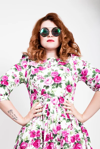 Young stylish red-haired woman with curly hair and pretty face posing in sunglasses. expresses different emotions Royalty Free Stock Photos