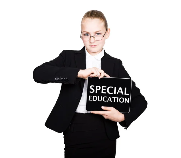 Schoolmeisje in een Business Suit houdt een PC Tablet in zijn handen met inscriptie Special education — Stockfoto