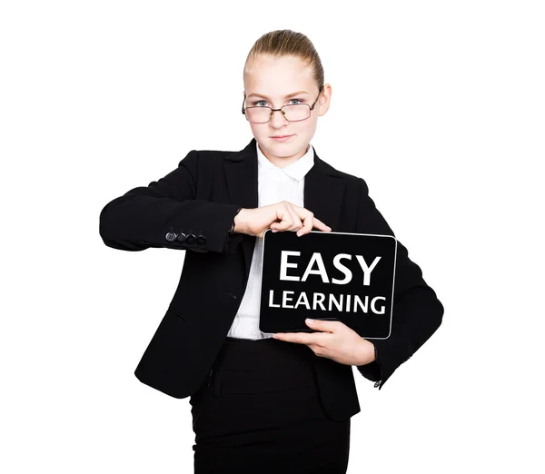 Schoolmeisje in een Business Suit houdt een PC Tablet in zijn handen met inscriptie gemakkelijk leren — Stockfoto