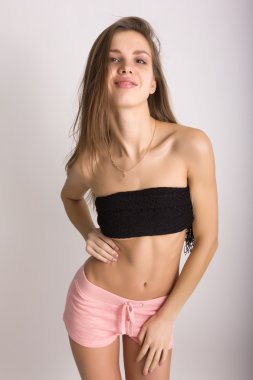 sexy young woman wearing pink shorts