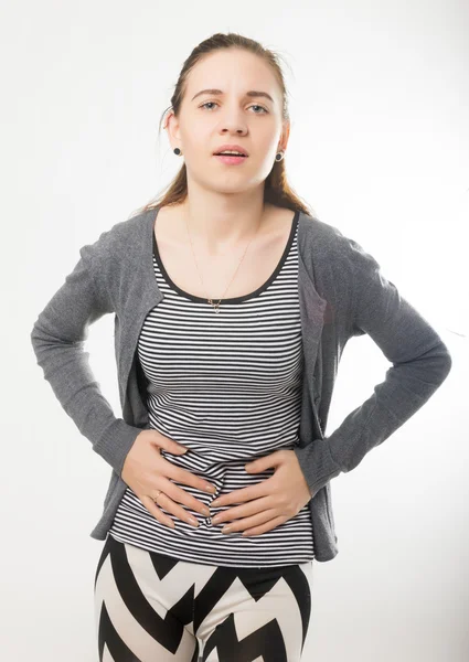 Menstruation pain or stomacbeautiful young girl holding her stomach, abdominal pain during the menstrual cycleh ache — Stock fotografie