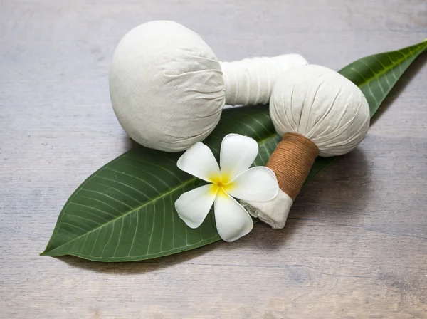 Spa massage compress balls, herbal ball on the leaves with spa flower, Thailand, select focus