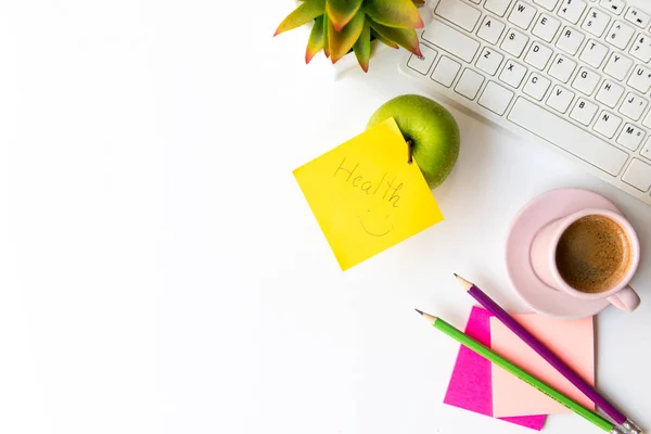 Healthy snack and lunch with working in office. Top view Green apple with black coffee pink cup for diet Health on white table working. Healthy Lifestyle Concept