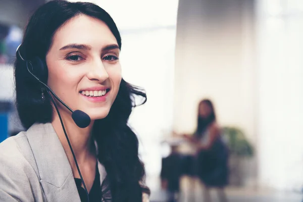 Call center and customer service team support for information operator at work.  People woman employee consultant and talking on hands free phone for help and service customer