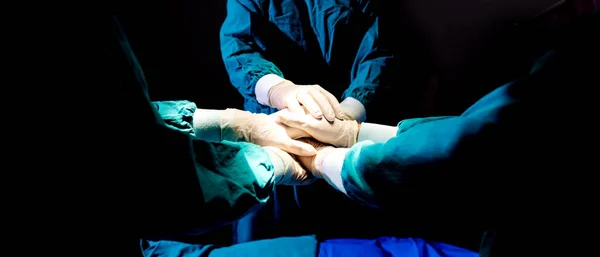 Close up hands team of medical workers holding hands together in hospital.  Group doctor coordinate hands for success work.  Health care Concept