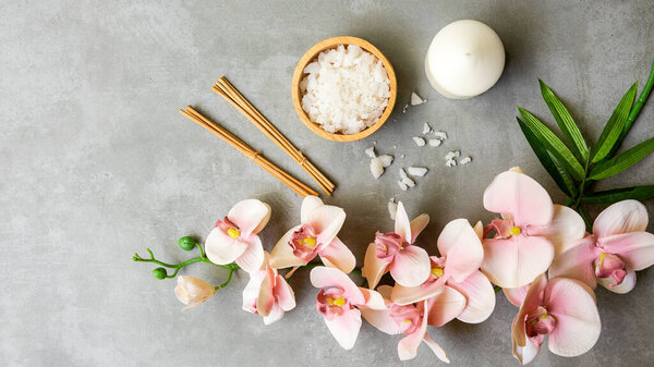 Massage Thai Spa.  Spa massage setting for treatment and relax with  pink orchid on blackboard.  Lifestyle Healthy Concept,  copy space for banner, top view