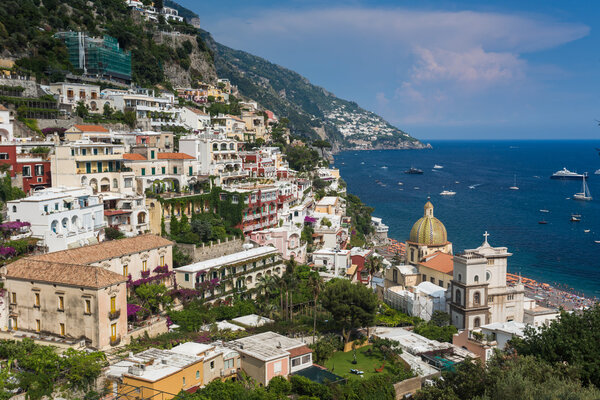 Beautiful city Positano on rocky seashore in Positano, Italy