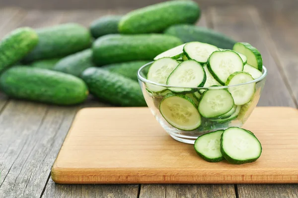 Chopped Fresh Cucumber Slices Clear Glass Bowl Wooden Table Rustic — 图库照片