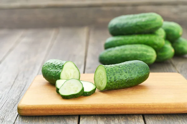 Whole Sliced Cucumbers Cutting Board Copy Space Text — Stock Photo, Image