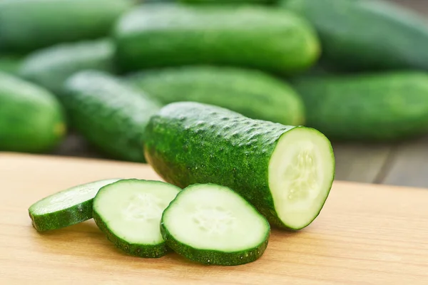 Whole Sliced Fresh Cucumbers Cutting Board — Stock Photo, Image