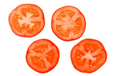Kırmızı domates dilimleme üst görüş izole. Yuvarlak domates dilimleri..