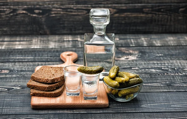 Russian vodka in small glass with black bread and pickles — Stock Photo, Image