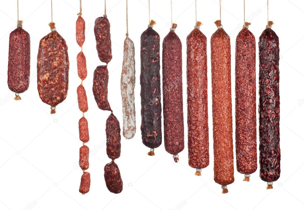 large variety of vertically arranged salami sausages isolated 