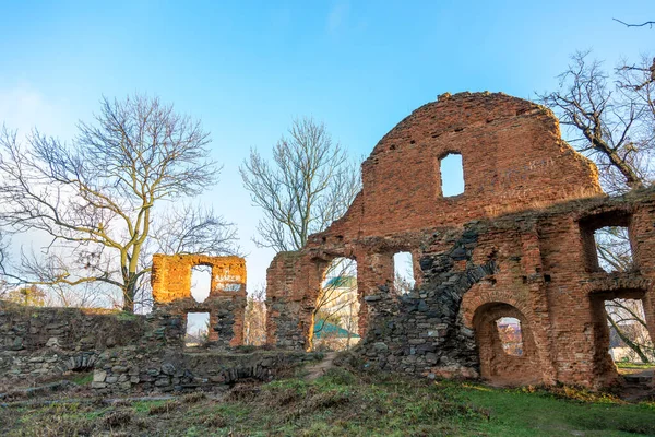 Ruined fortress against the blue sky. The ruins of an ancient fortress watchtower against the blue sky