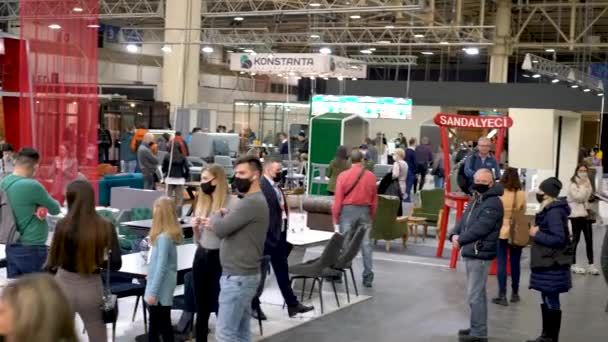 Kiev, Ukraine March 5 2021. Furniture exhibition during a pandemic. international furnishing accessories exhibition. Equipment for the production of furniture. Exhibition and social distance — Stock Video