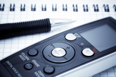 Journalist equipment. Digital voice recorder, pen, notebook clipart