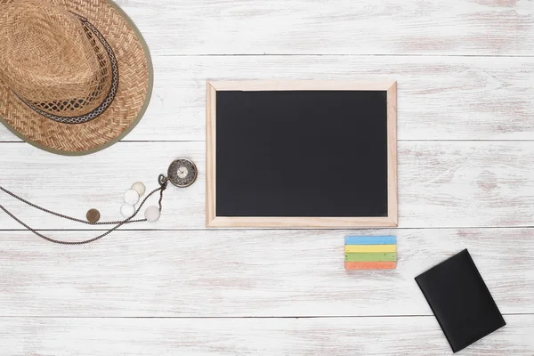 Workplace with hat and blackboard — Stock Photo, Image