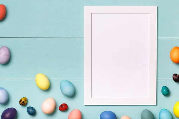 Easter eggs on wooden workplace — Stock Photo, Image