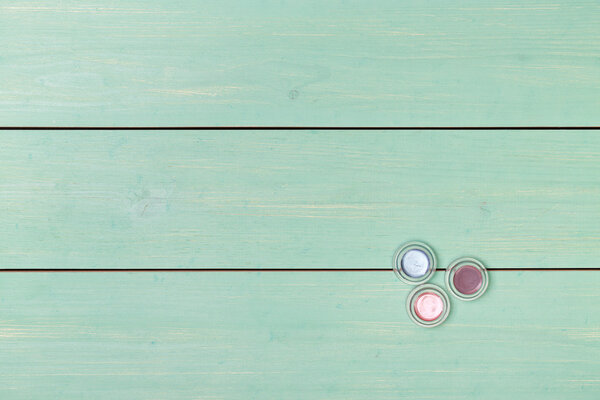 Cosmetics. Three colorful eyeshadows