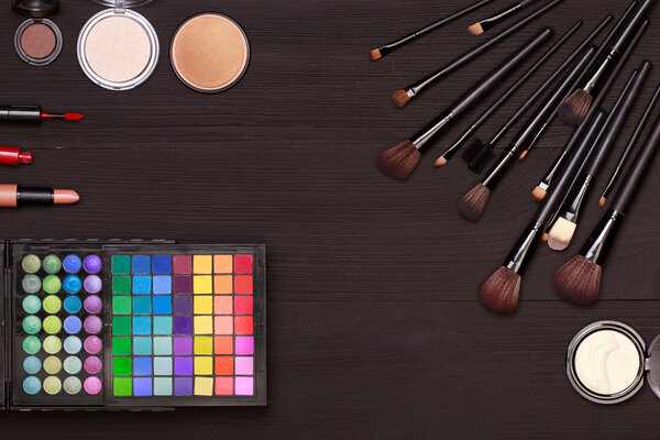 Set of cosmetics on wooden table