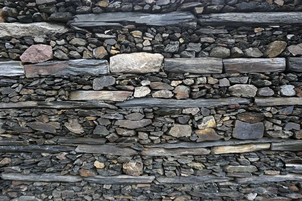 Textura, fundo de pedras diferentes tamanhos e cores das paredes — Fotografia de Stock