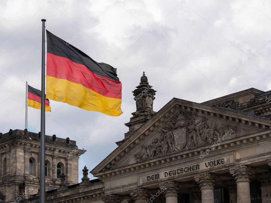 Germany Flags In Front of The Reichstag Building In Berlin, Germany
