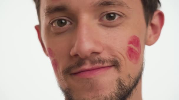 Young Beautiful Caucasian Bearded Man Shows Kiss Spots Red Lipstick — Stock Video