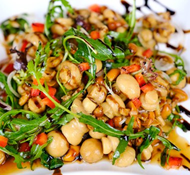 Pickled honey mushrooms close-up. Canned mushrooms in marinade. High quality photo