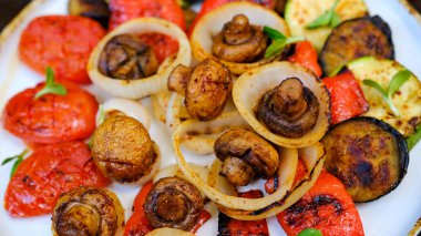 Grilled vegetables platter, roasted eggplants, potatoes, mushrooms and green asparagus. Space for text. High quality photo
