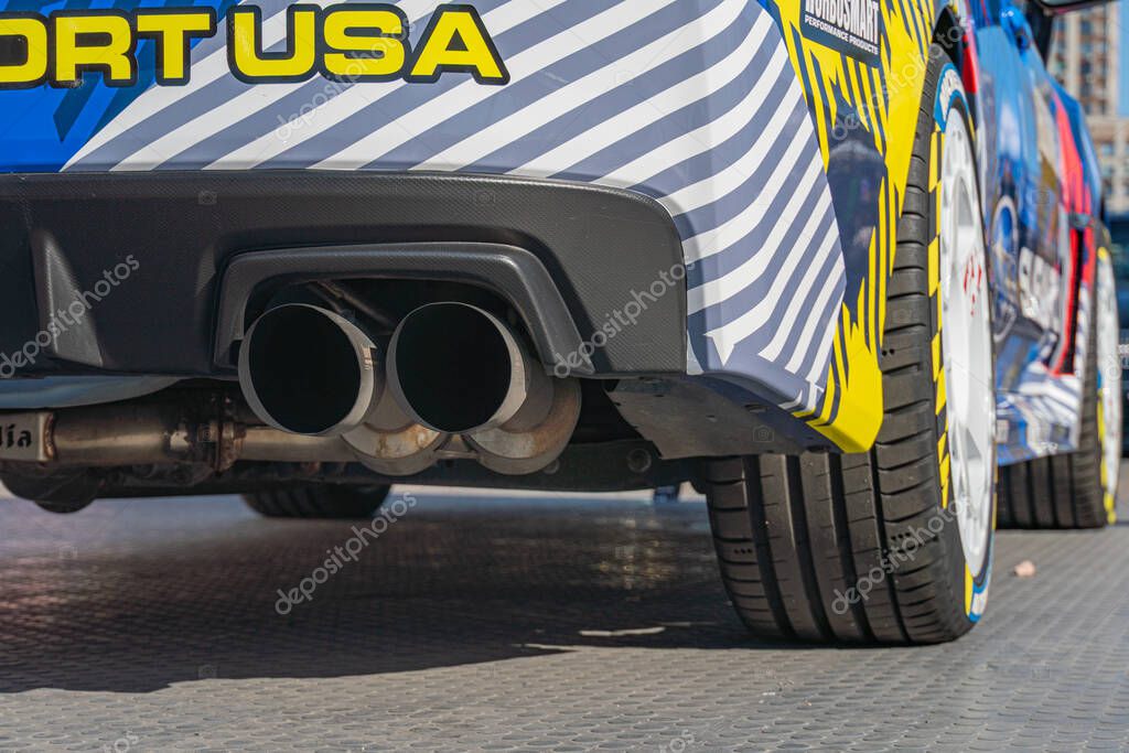 Rally car, Subaru model, rear section focus, exhaust pipes, number 5, blue and yellow livery, concrete trackroad, natural lighting, aerodynamic design, action-ori Kyiv, Ukraine - September 21, 2025