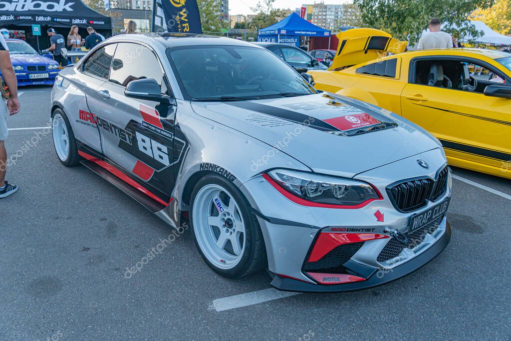 Modified BMW car in outdoor setting, showcasing custom bodywork, racing decals, large alloy wheels, sleek headlights, and aerodynamic features Possibly used for rac Kyiv, Ukraine - September 21, 2025