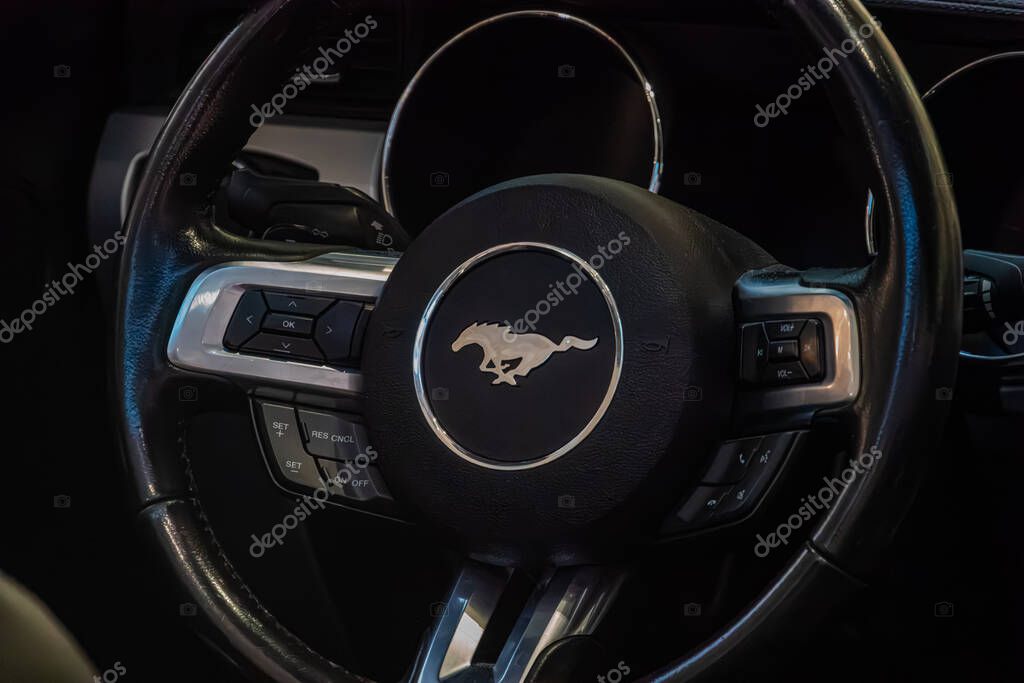 Close-up view of a modern Ford Mustang steering wheel, distinctive logo visible Kyiv, Ukraine - September 21, 2025