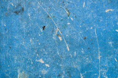 Yüksek kaliteli, yıpranmış mavi bir arka plan, ağır çizikler, kir ve aşınmış. Pis endüstriyel yüzey. Üst görünüm.