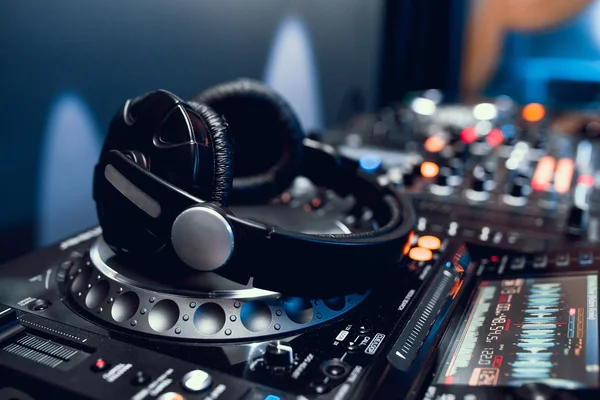 Headphones on dj board in night club — Stock Photo, Image
