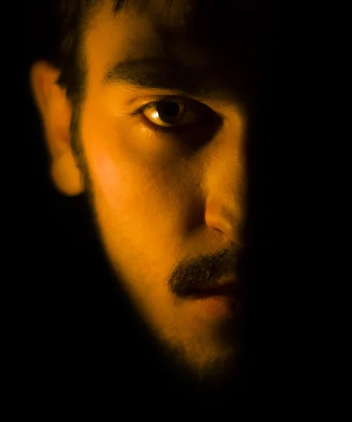 Half of the face is closed by the shadow — Stock Photo, Image