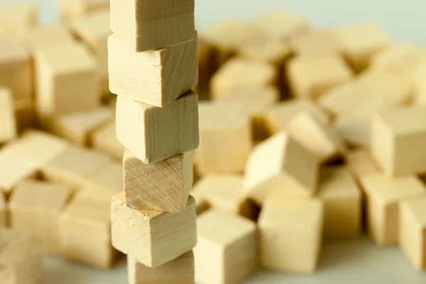 Tower structure of dislocated wooden cubes