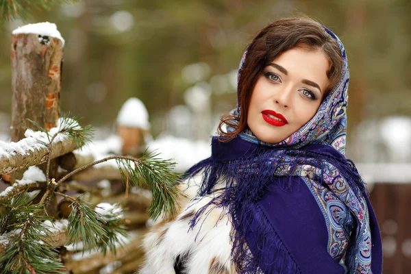 Portrait of beautiful sexy brunette girl in a blue scarf in the — Stock Photo, Image