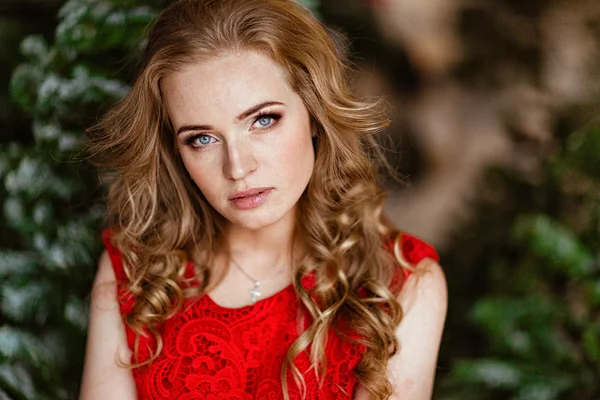 Portrait of a red haired girl in red dress — Stock Photo, Image